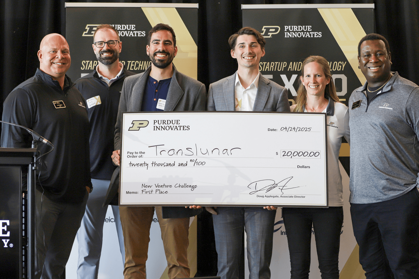 Translunar team receiving the \$20 000 first‑place check at the New Venture Challenge